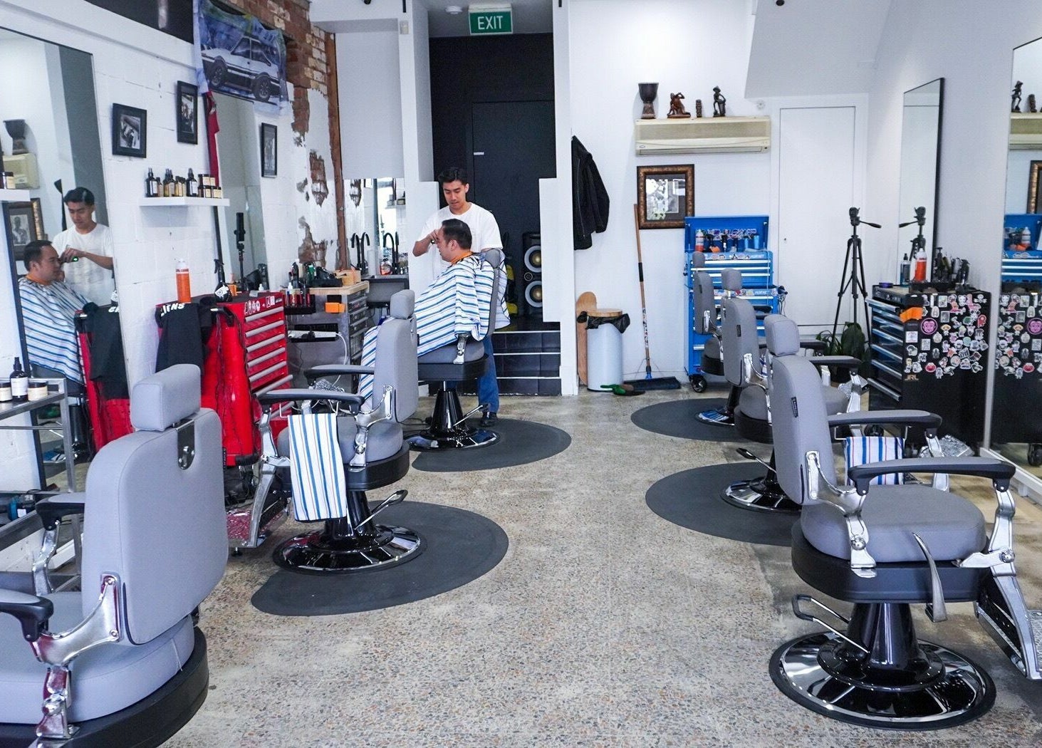 Interior of Be Good Studio barber area in Melbourne, Victoria, AU, showcasing stylish chairs and mirrors.