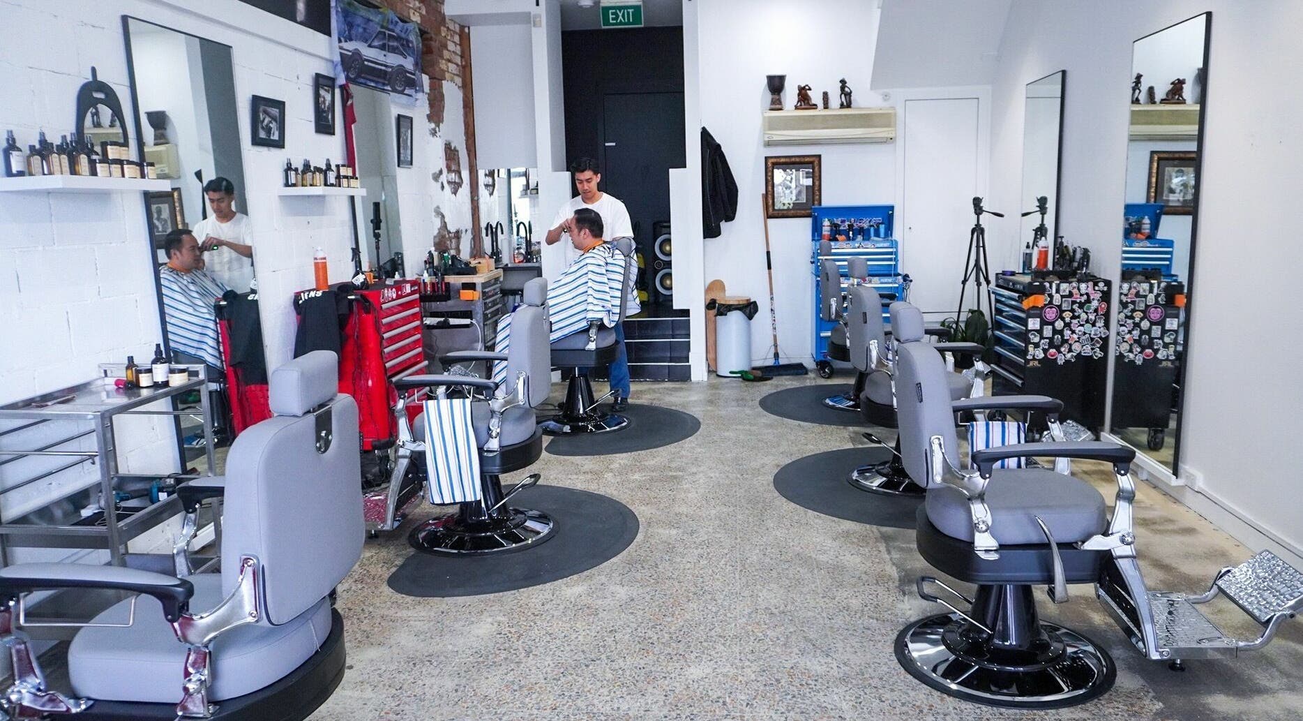 Interior of Be Good Studio barber area in Melbourne, Victoria, AU, showcasing stylish chairs and mirrors.