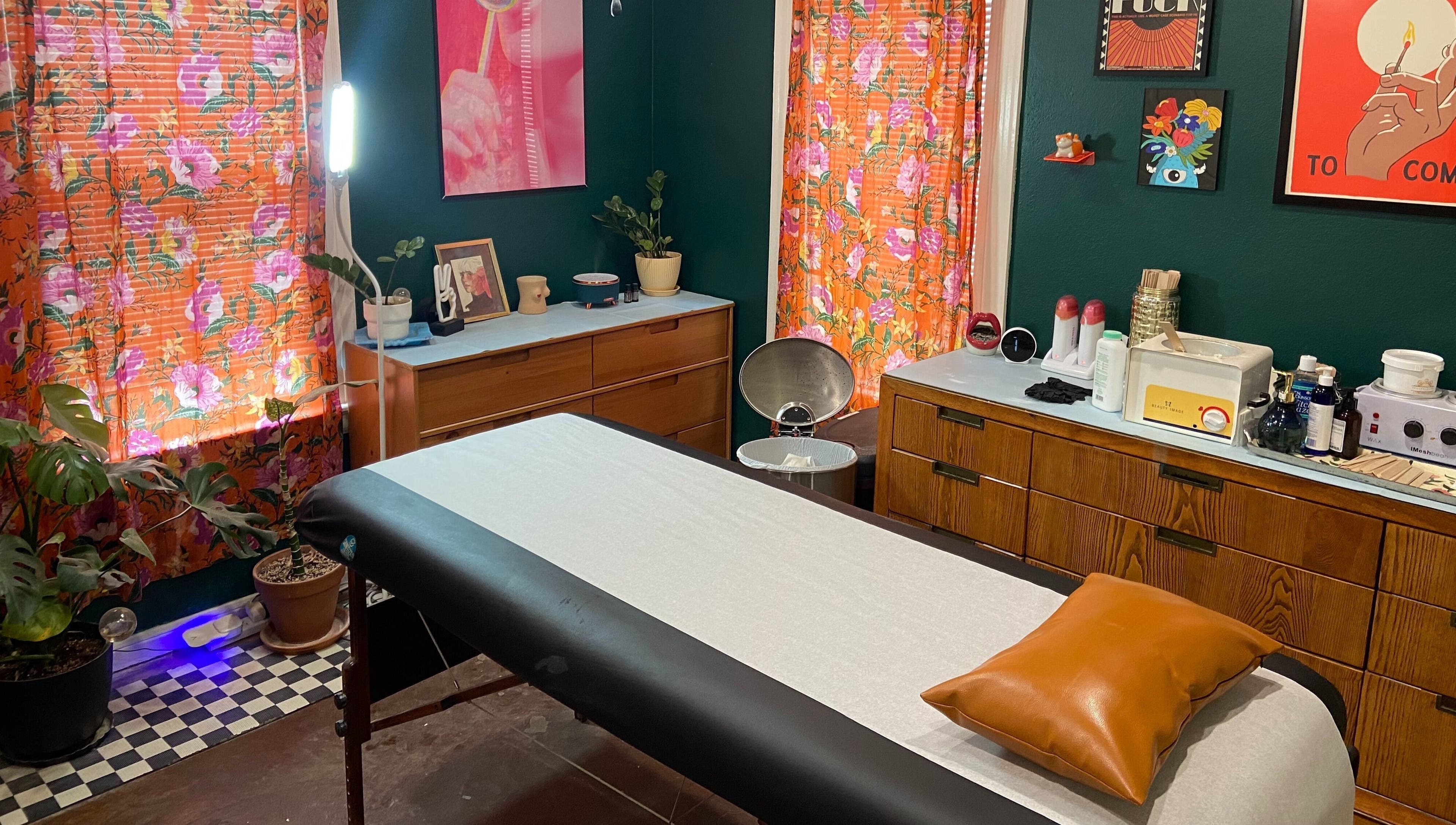 Rejuvenating treatment room at Nood Wax & Sugar ATX, Austin, Texas. Floral decor creates a warm, inviting ambiance.