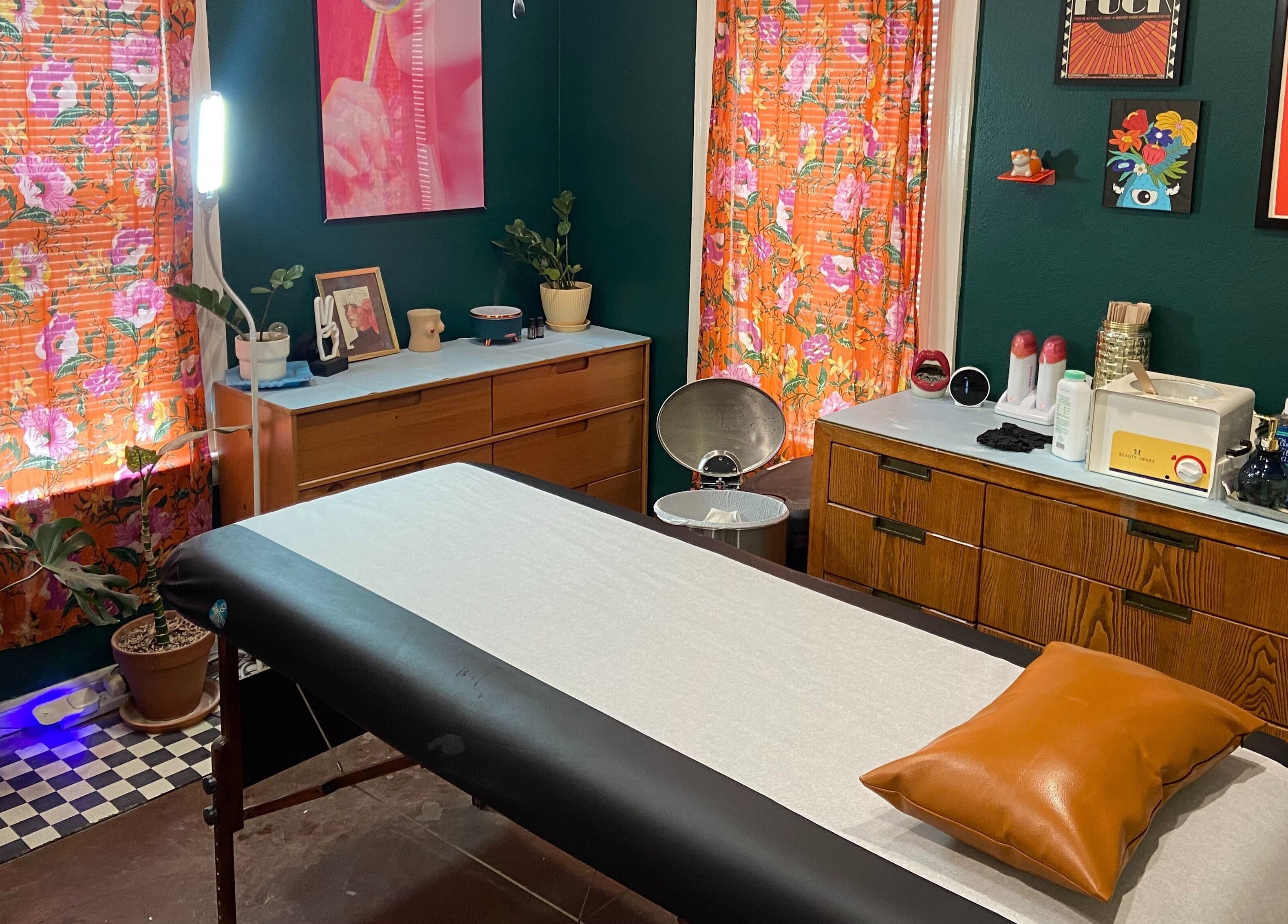 Rejuvenating treatment room at Nood Wax & Sugar ATX, Austin, Texas. Floral decor creates a warm, inviting ambiance.