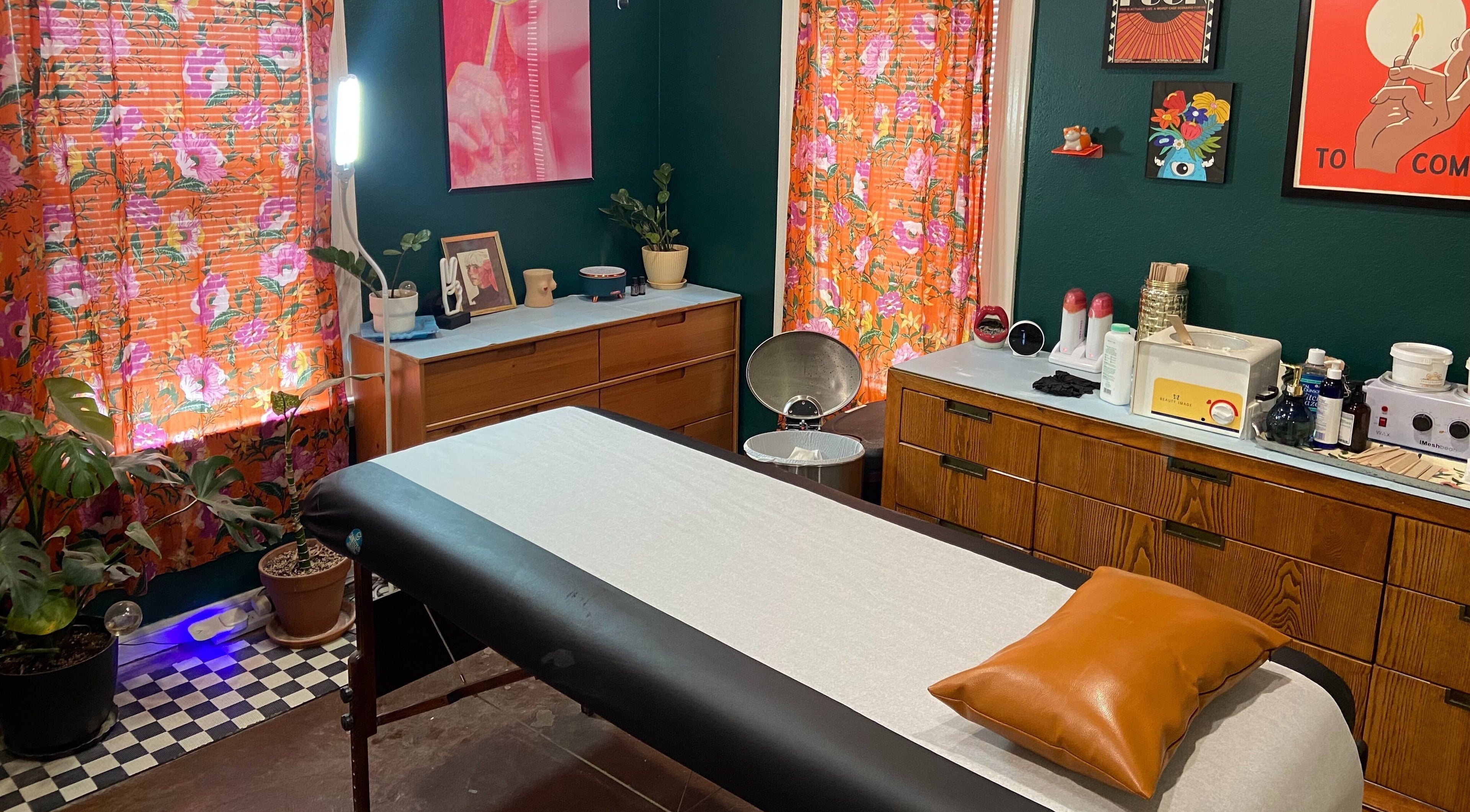 Rejuvenating treatment room at Nood Wax & Sugar ATX, Austin, Texas. Floral decor creates a warm, inviting ambiance.