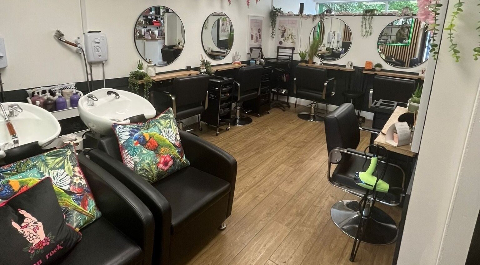 Modern interior of Bijou Hair & Beauty Ltd in Derby, England, GB, featuring stylish salon chairs and mirrors.