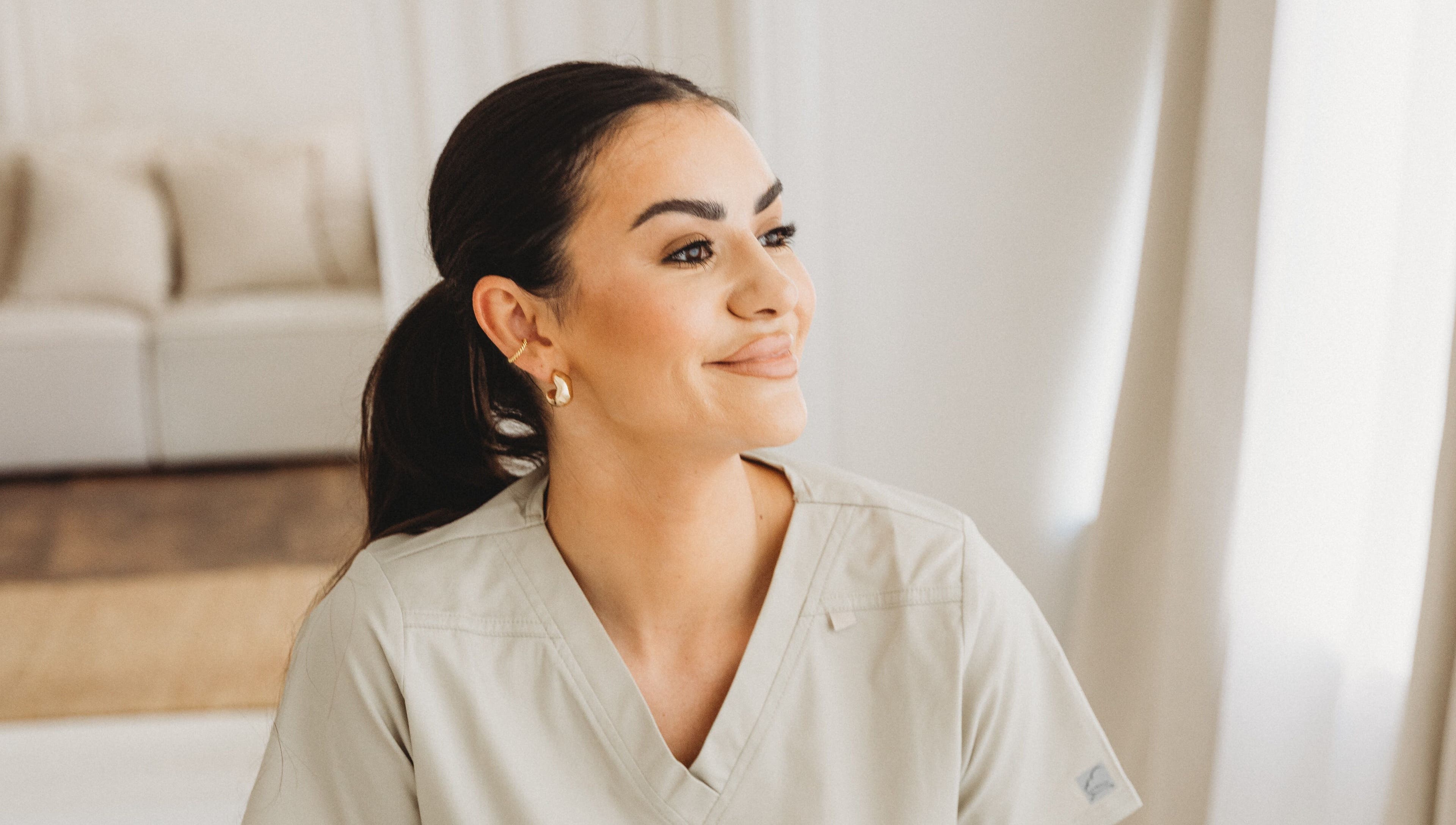 Staff member with a welcoming smile at Aim Medical Aesthetics - Aberystwyth Clinic, Aberystwyth, Wales, GB.