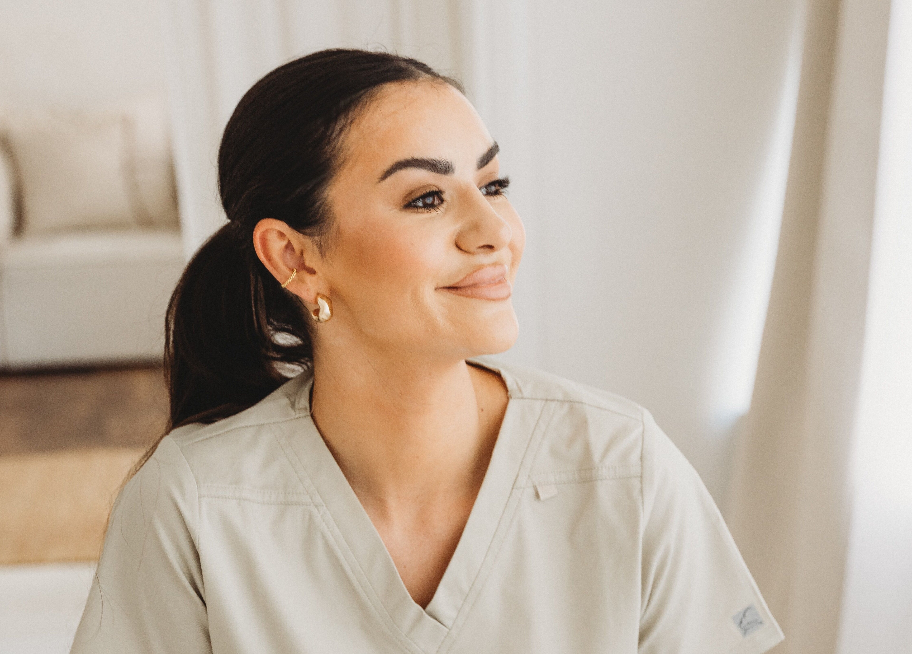 Staff member with a welcoming smile at Aim Medical Aesthetics - Aberystwyth Clinic, Aberystwyth, Wales, GB.