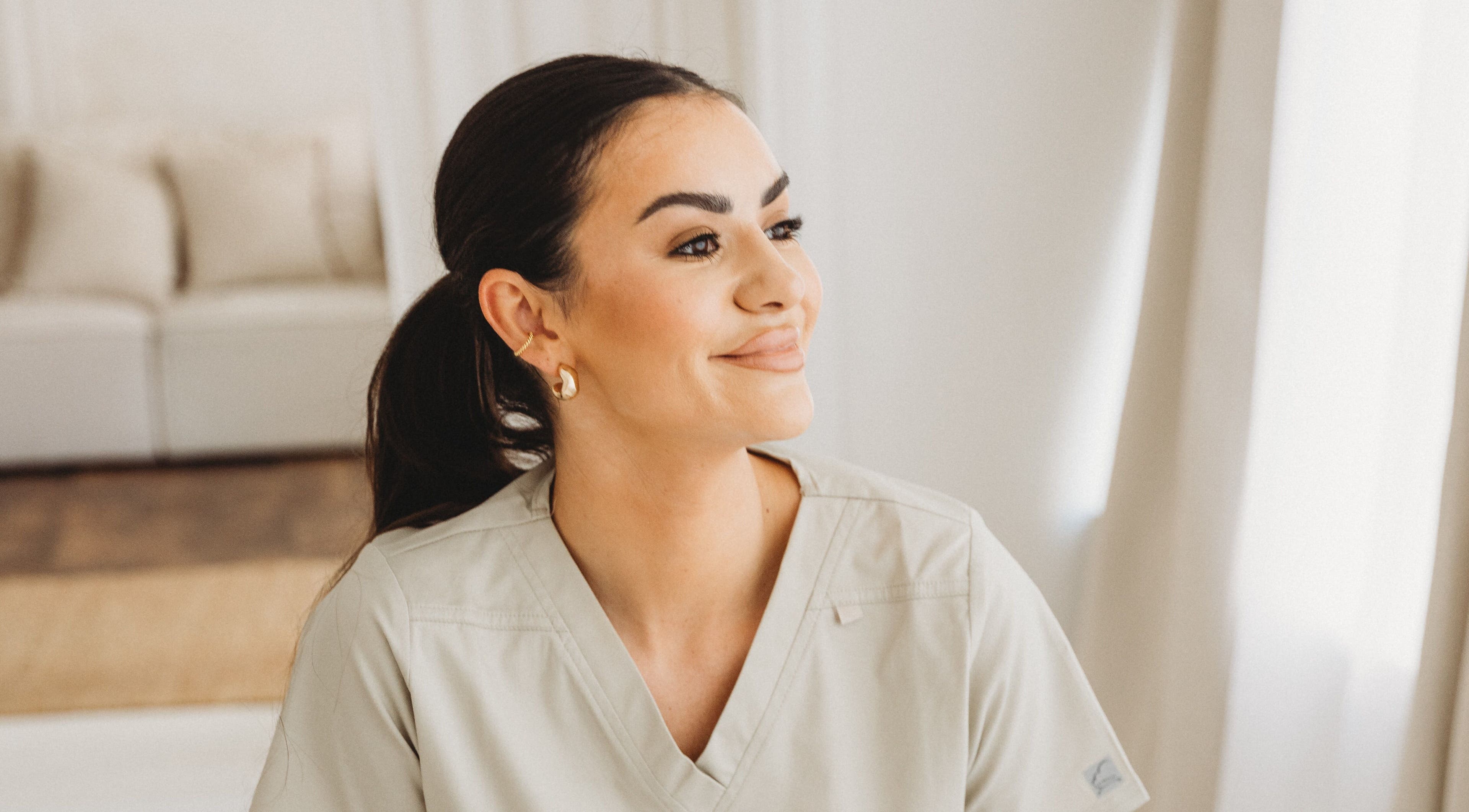 Staff member with a welcoming smile at Aim Medical Aesthetics - Aberystwyth Clinic, Aberystwyth, Wales, GB.