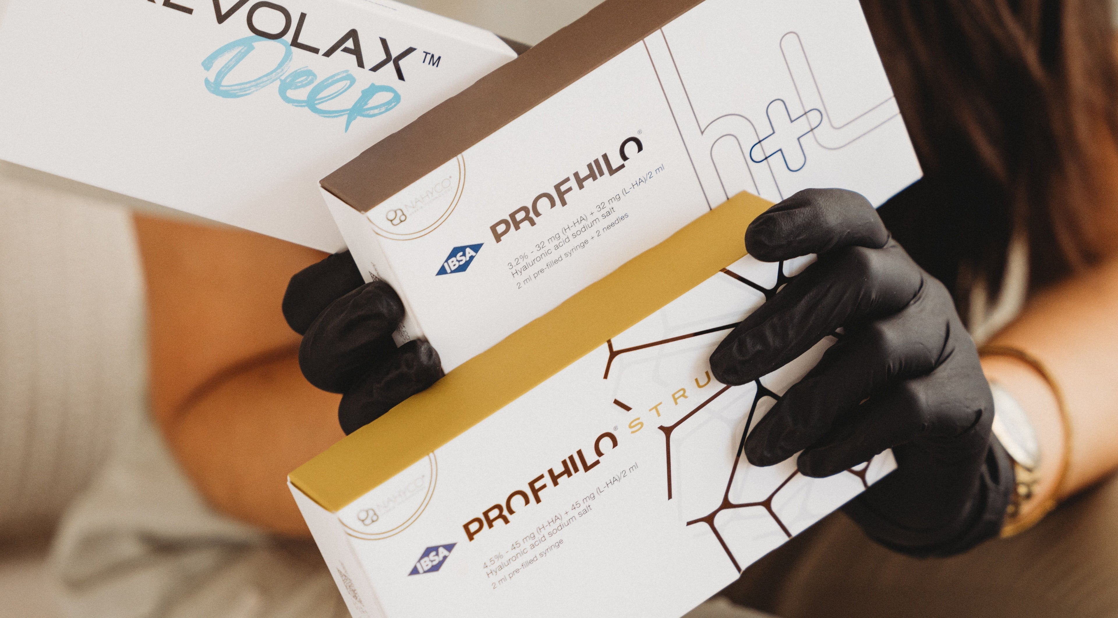 Professional holding beauty products at Aim Medical Aesthetics - Aberystwyth Clinic, Aberystwyth, Wales, GB.