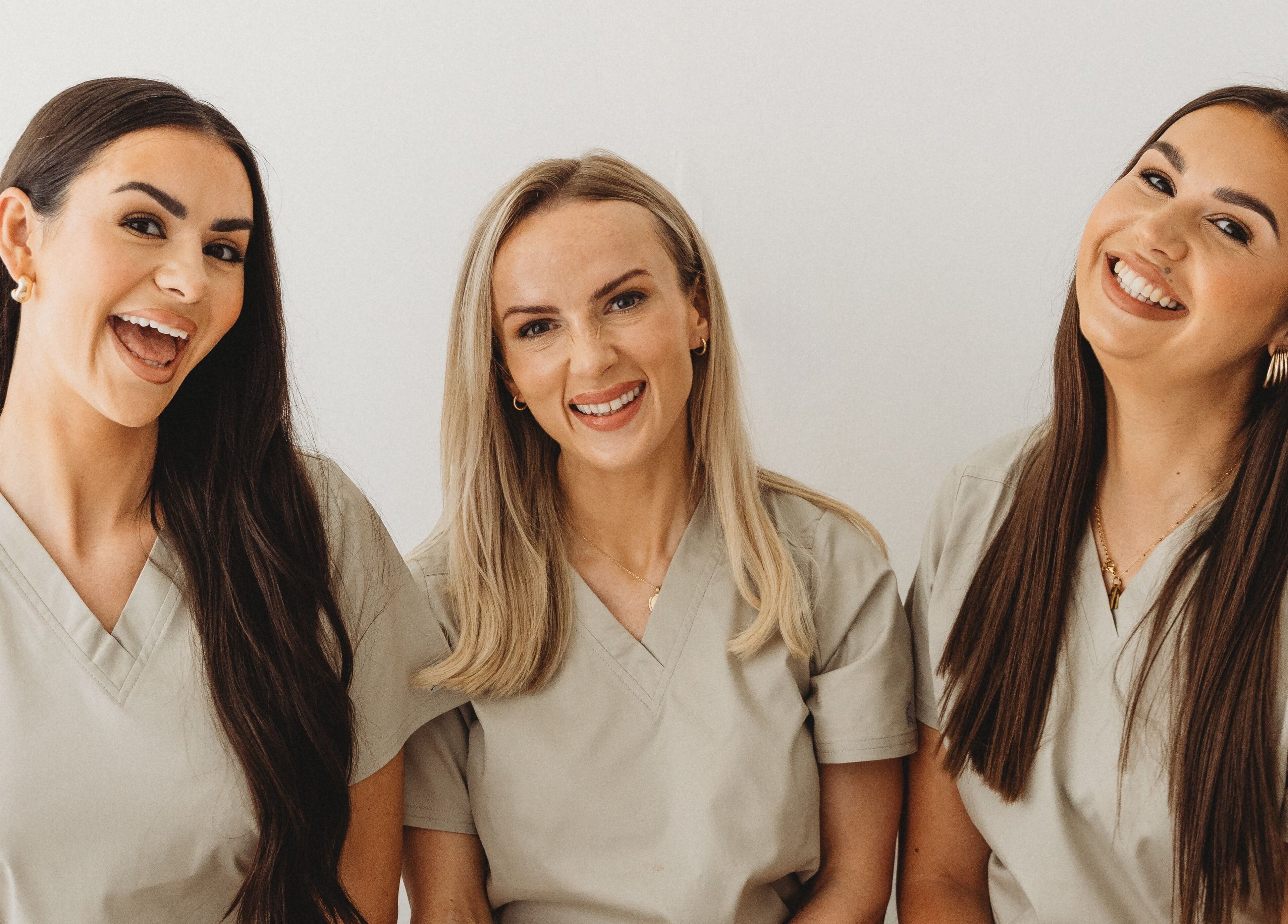 Smiling team of professionals at Aim Medical Aesthetics - Aberystwyth Clinic, Aberystwyth, Wales, GB.