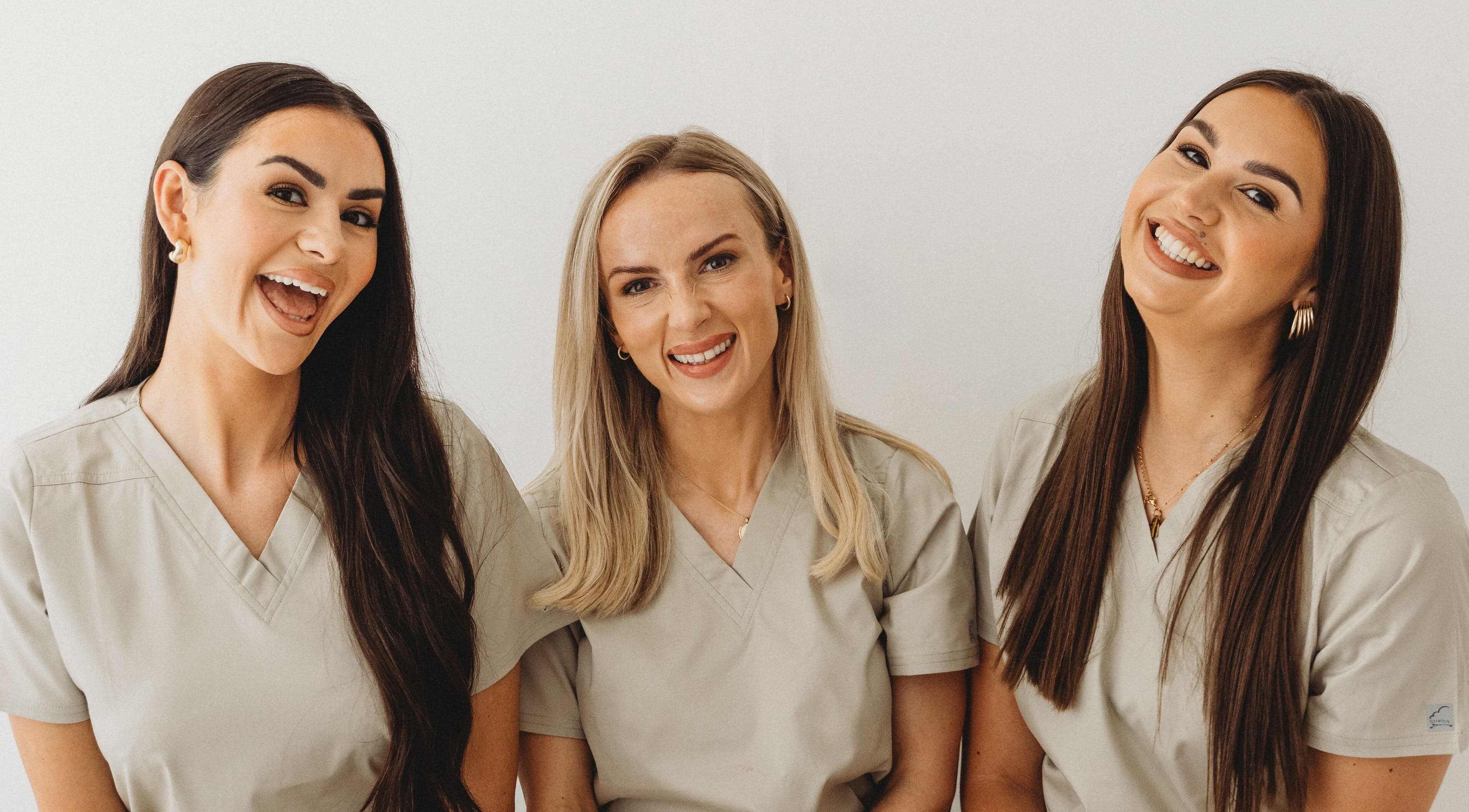 Smiling team of professionals at Aim Medical Aesthetics - Aberystwyth Clinic, Aberystwyth, Wales, GB.