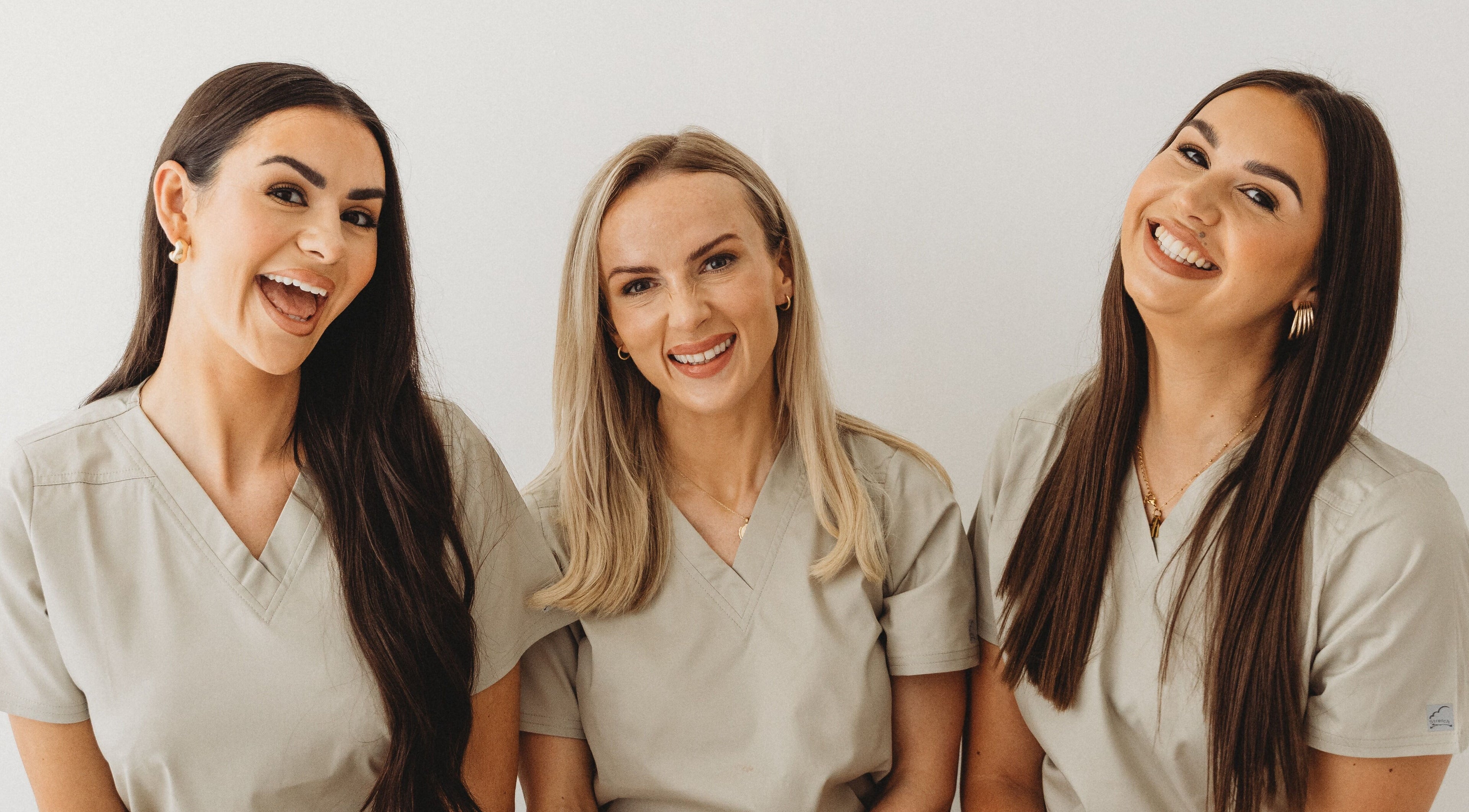 Smiling team of professionals at Aim Medical Aesthetics - Aberystwyth Clinic, Aberystwyth, Wales, GB.