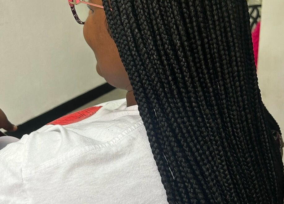 Intricate braids at Braid Couturee in Bridgetown, Saint Michael, BB showcase stunning hairstyling expertise.