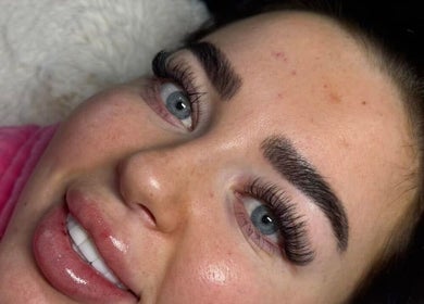 Close-up of a client's enhanced eyelashes and glowing skin at By Brown, Hetton-le-hole, England, GB.