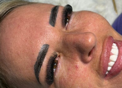 Close-up of a woman's face showcasing lash and brow enhancements at By Brown, Hetton-le-hole, England, GB.