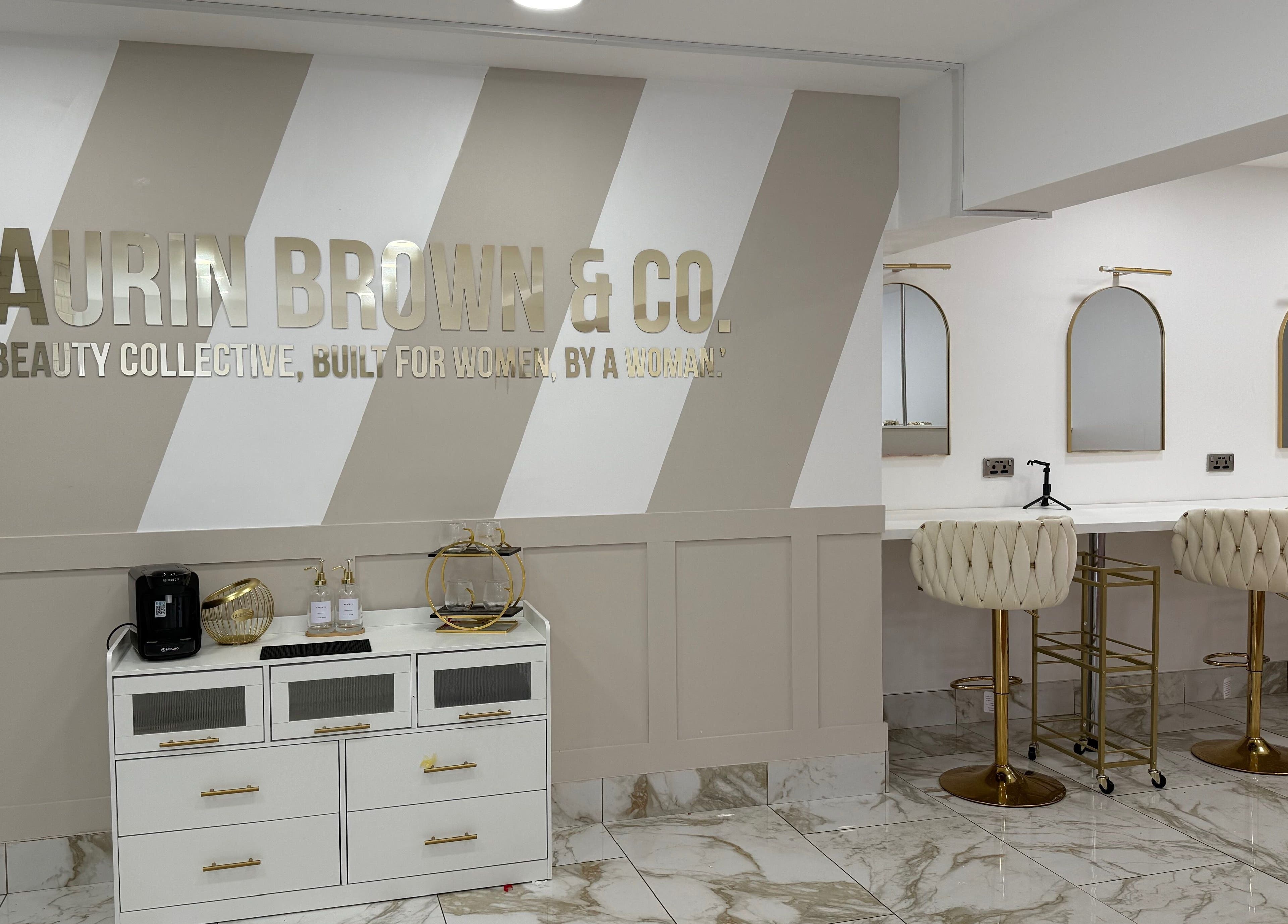 Chic interior of By Brown salon in Hetton-le-hole, England, featuring elegant seating and decor.