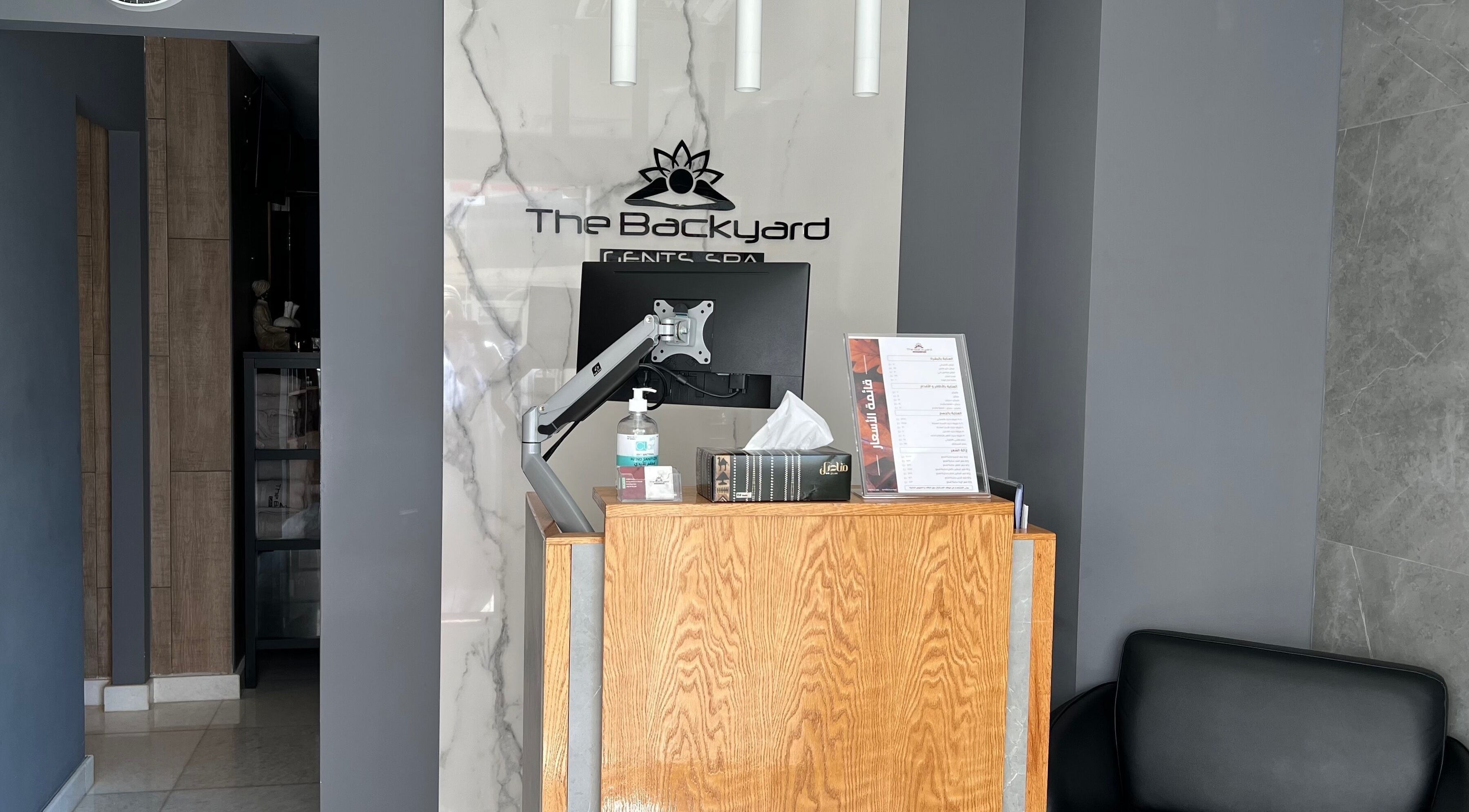 Reception desk at The Backyard Spa Alkhoudh, Sib, Muscat Governorate, OM with modern decor.