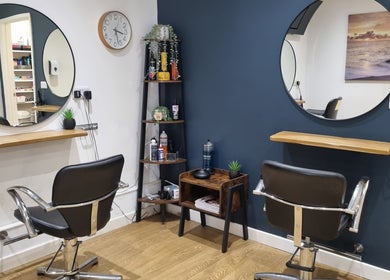 Chic salon chairs and mirrors at D&G Hairdressing, Chandler's Ford, England, GB, offering a stylish ambiance.