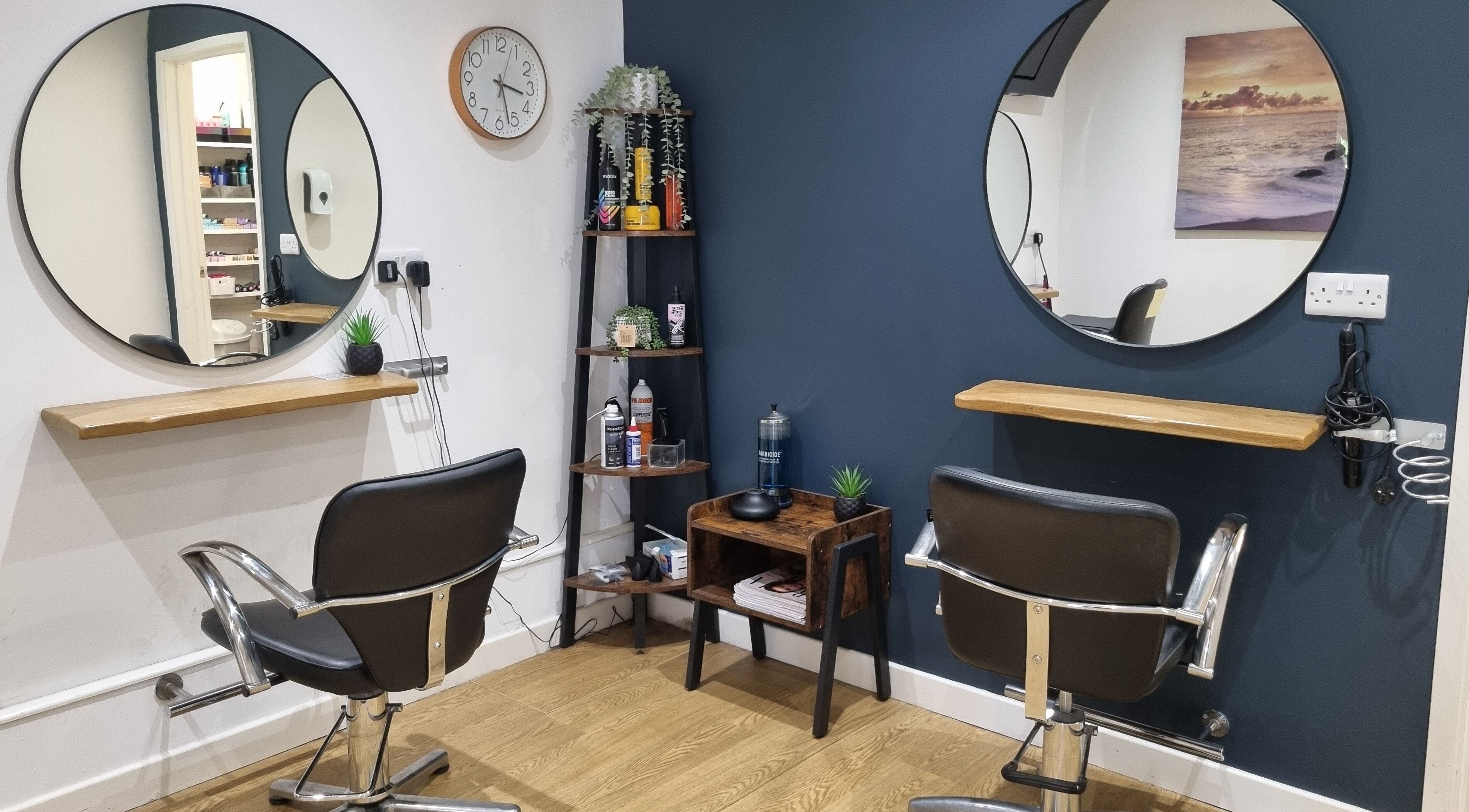 Chic salon chairs and mirrors at D&G Hairdressing, Chandler's Ford, England, GB, offering a stylish ambiance.