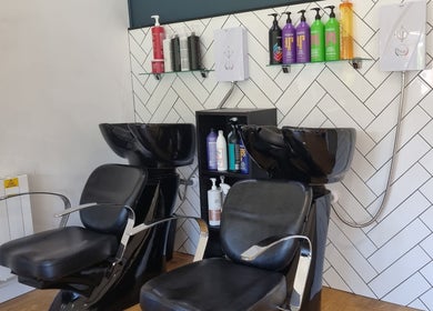 Stylish wash stations at D&G Hairdressing, Chandler's Ford, England, GB showcase sleek design and comfort.