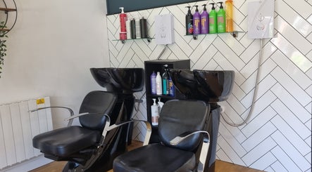 Stylish wash stations at D&G Hairdressing, Chandler's Ford, England, GB showcase sleek design and comfort.