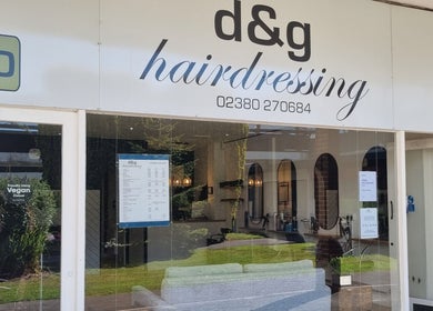Exterior view of D&G Hairdressing in Chandler's Ford, England, GB showcasing its inviting glass storefront.