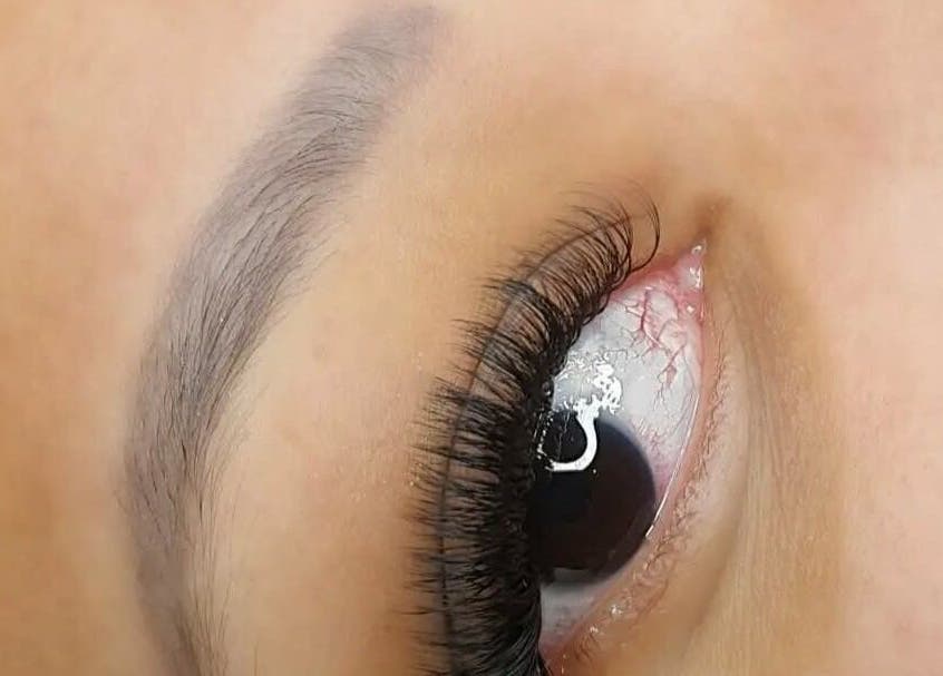 Close-up of expertly applied eyelash extensions at Golden Goddess Lashes- Lazy Moose spa in Ezembeni, Kwazulu-natal, ZA.