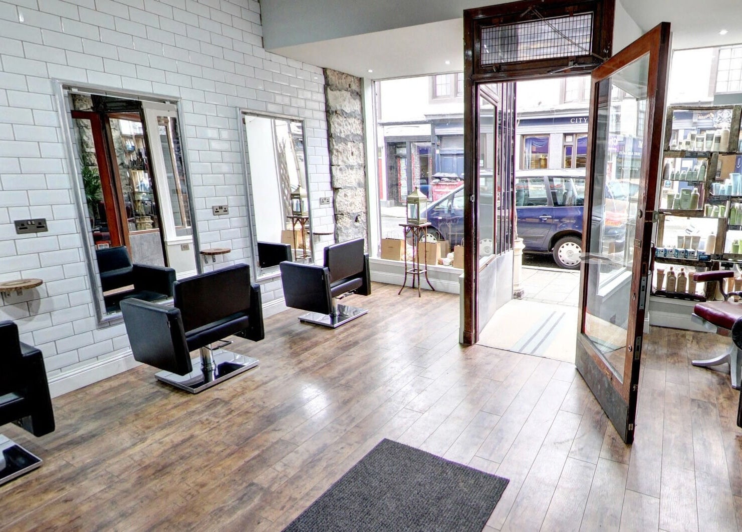 Chic salon at Claire @ Vollood, Dunfermline, Scotland, GB, showcasing modern chairs and wall accents.