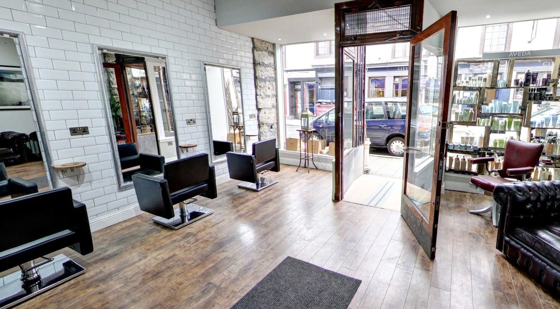 Chic salon at Claire @ Vollood, Dunfermline, Scotland, GB, showcasing modern chairs and wall accents.