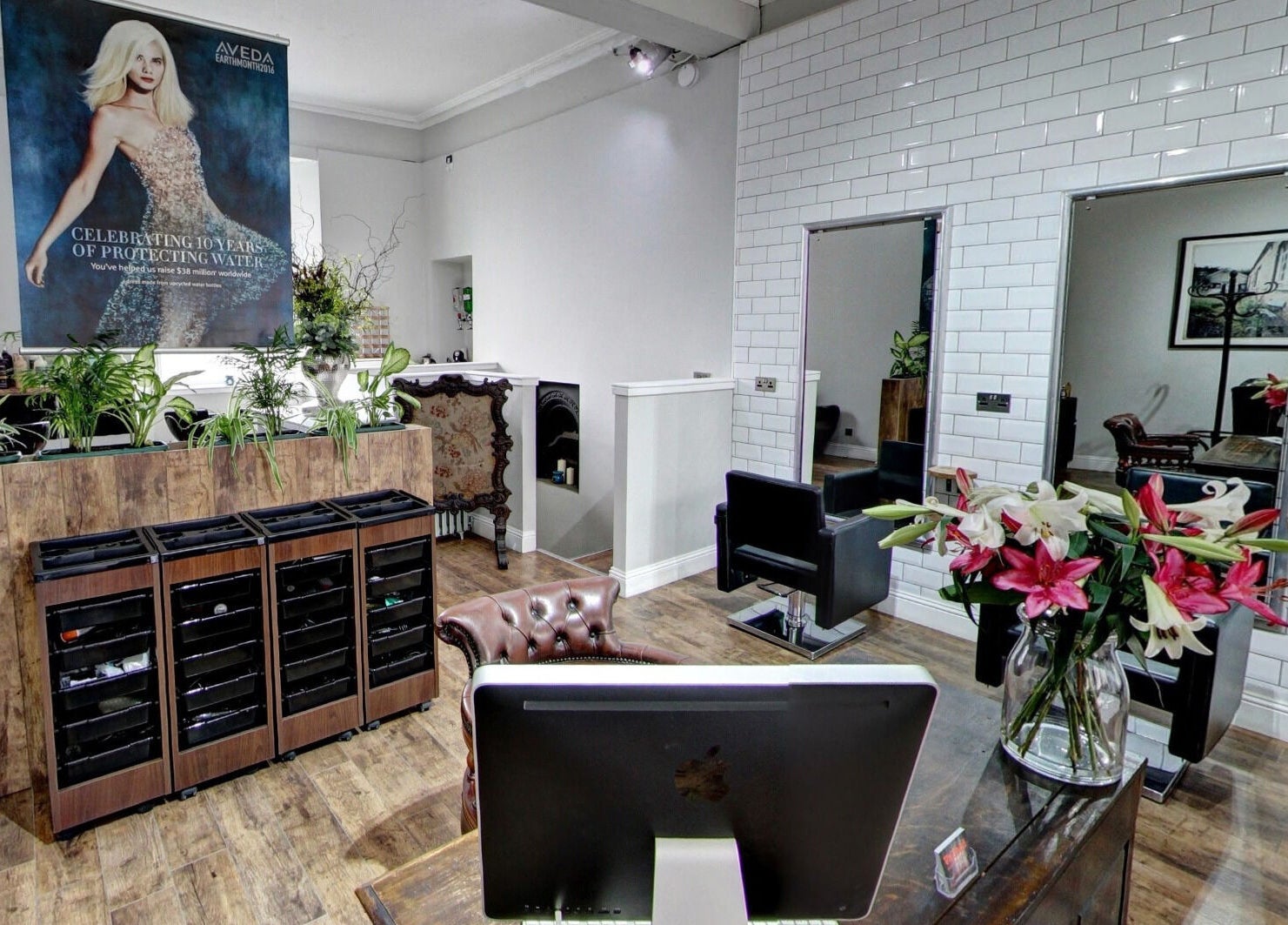 Elegant interior of Claire @ Vollood, Dunfermline, Scotland, GB, featuring chic design and vibrant flowers.