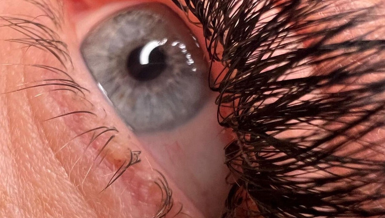 Close-up of eye with eyelashes at Berry Boutique, Epsom, England, GB showcasing beauty services.