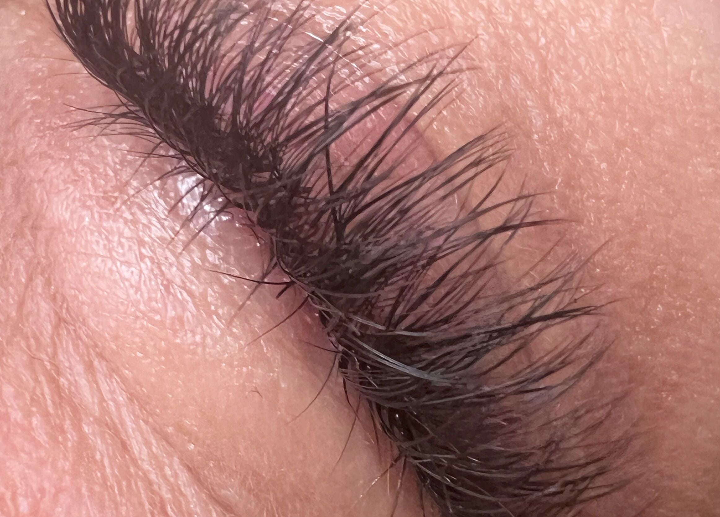 Close-up of lush, natural eyelashes at Berry Boutique, Epsom, England, GB, showcasing beauty expertise.