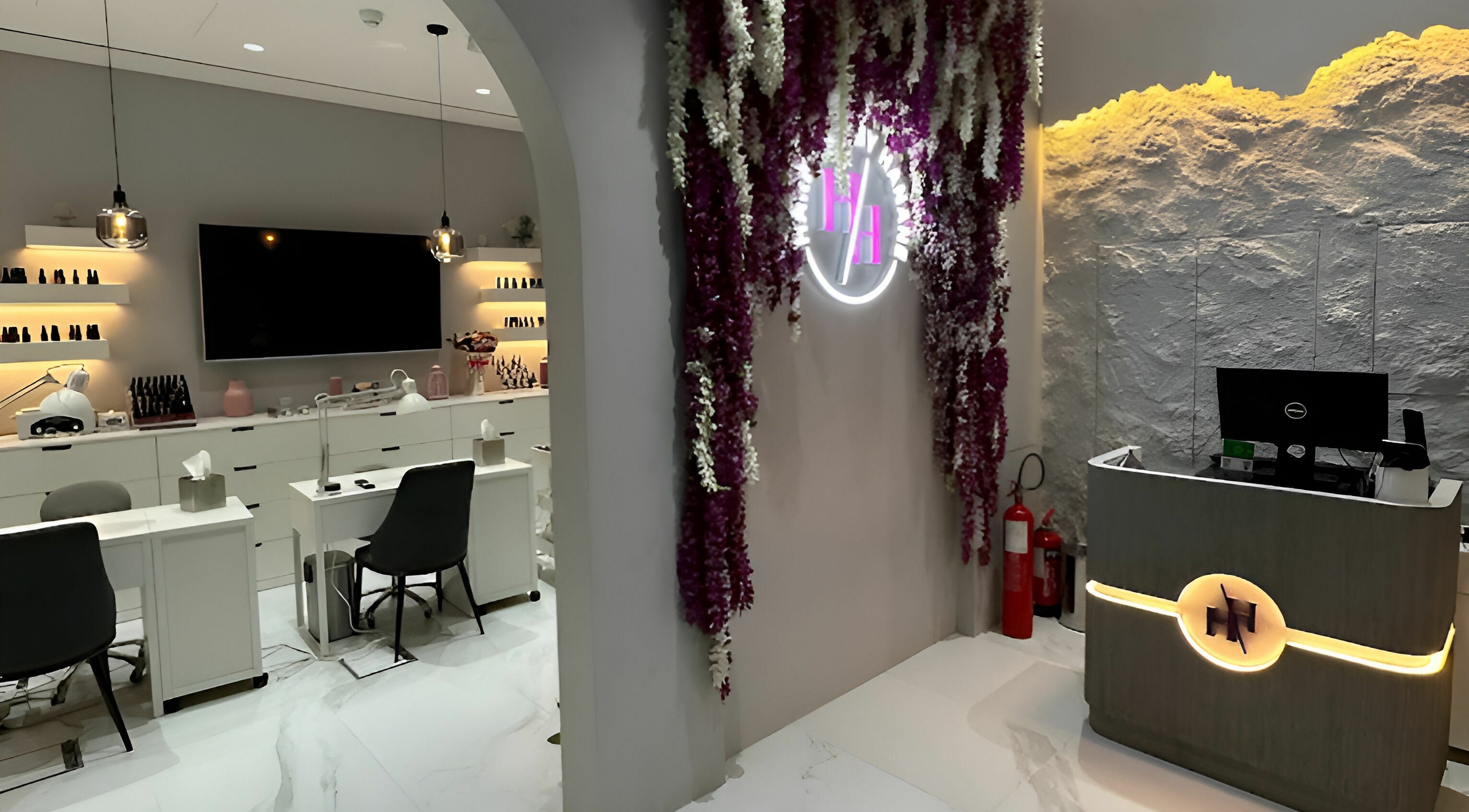 Modern interior of Harmony by Hanane Ladies Salon, Dubai, AE, featuring elegant decor and workstations.