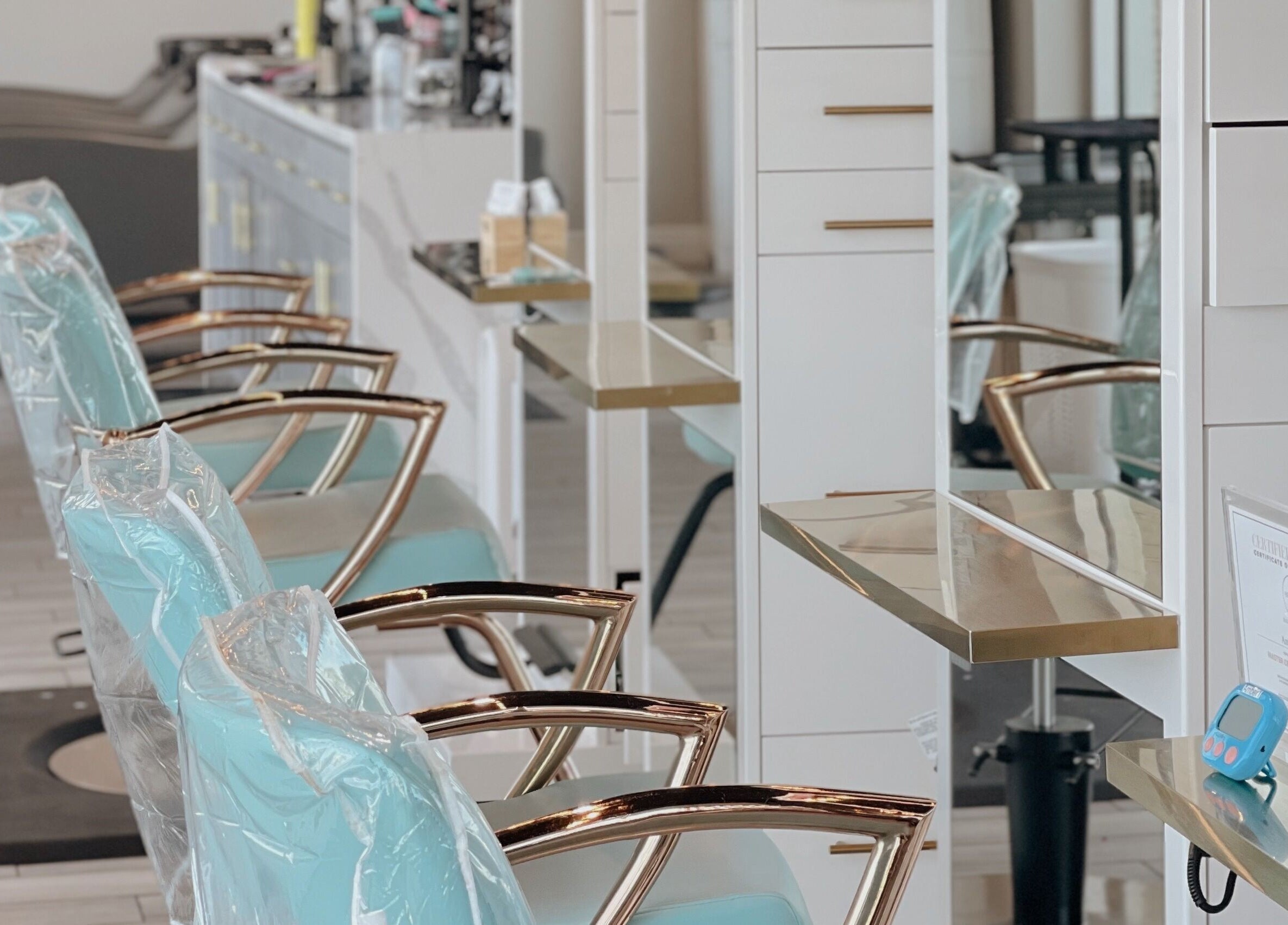 Stylish salon chairs in Tipsy Salonbar Naples, Naples, Florida, US, creating a modern and inviting atmosphere.