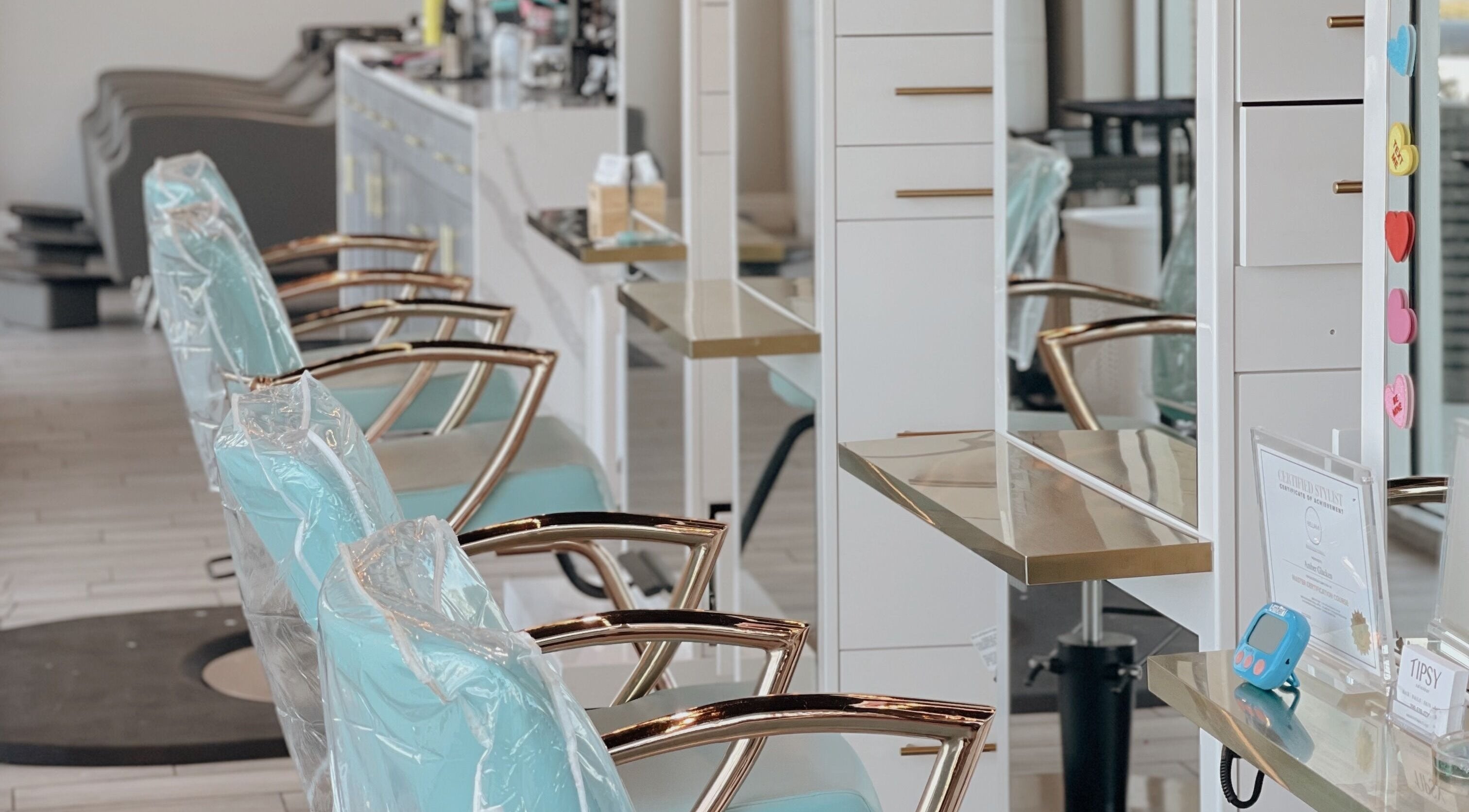 Stylish salon chairs in Tipsy Salonbar Naples, Naples, Florida, US, creating a modern and inviting atmosphere.