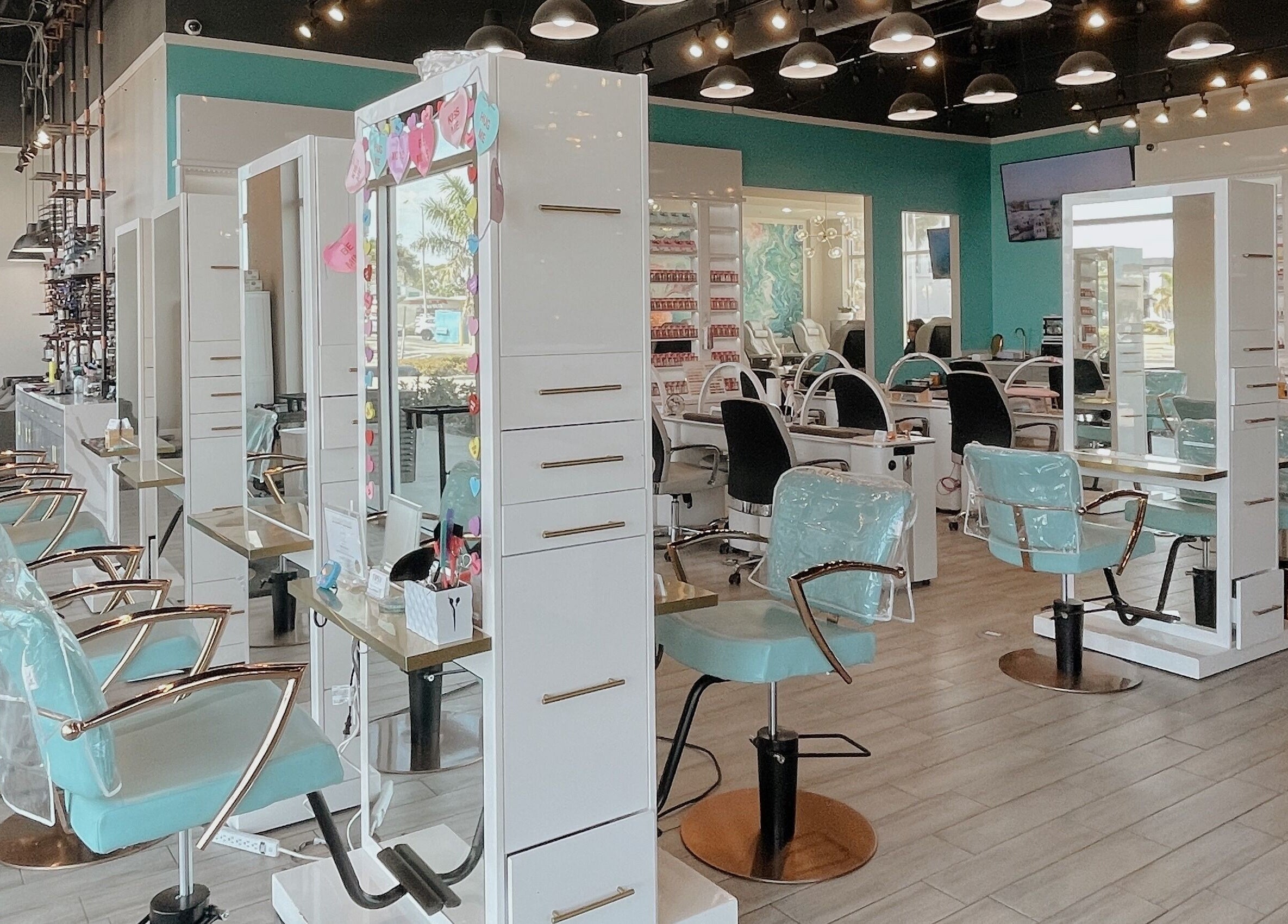 Interior of Tipsy Salonbar Naples showing stylish hair stations, Naples, Florida, US.