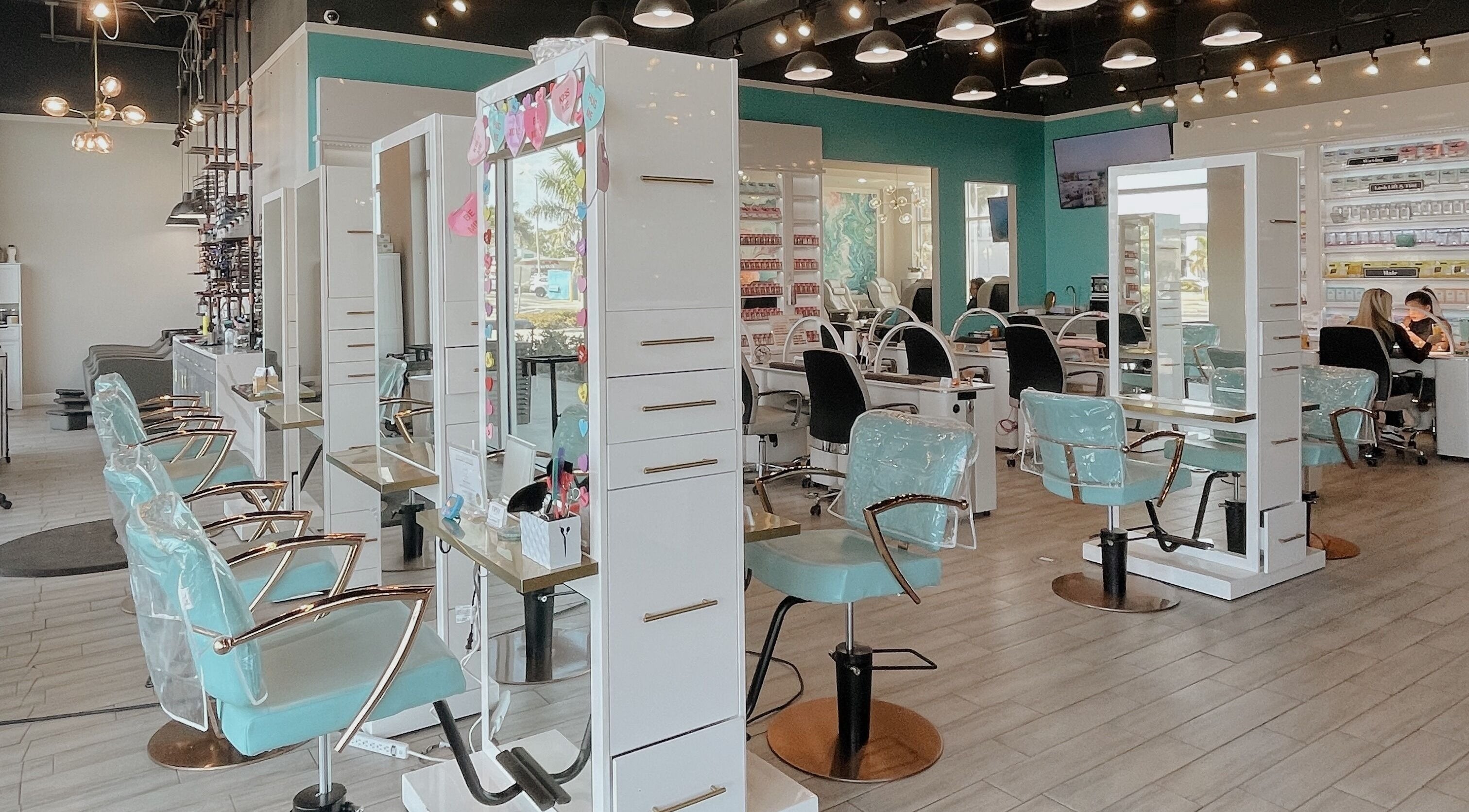Interior of Tipsy Salonbar Naples showing stylish hair stations, Naples, Florida, US.