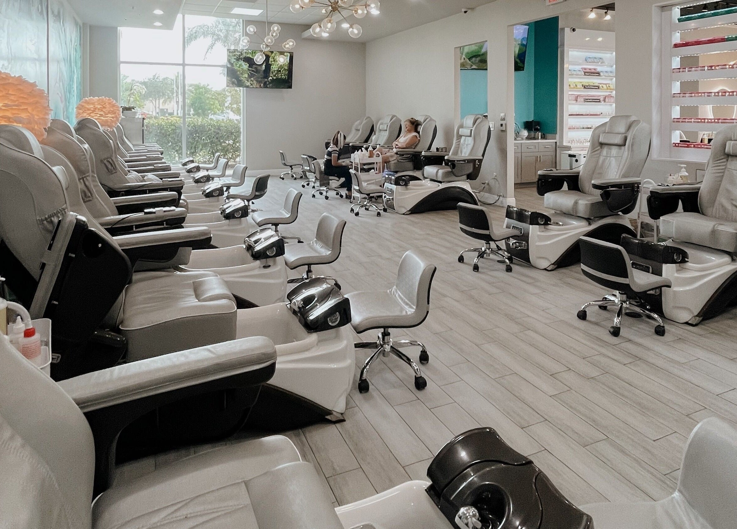 Spacious pedicure area at Tipsy Salonbar Naples, showcasing plush chairs in Naples, Florida, US.