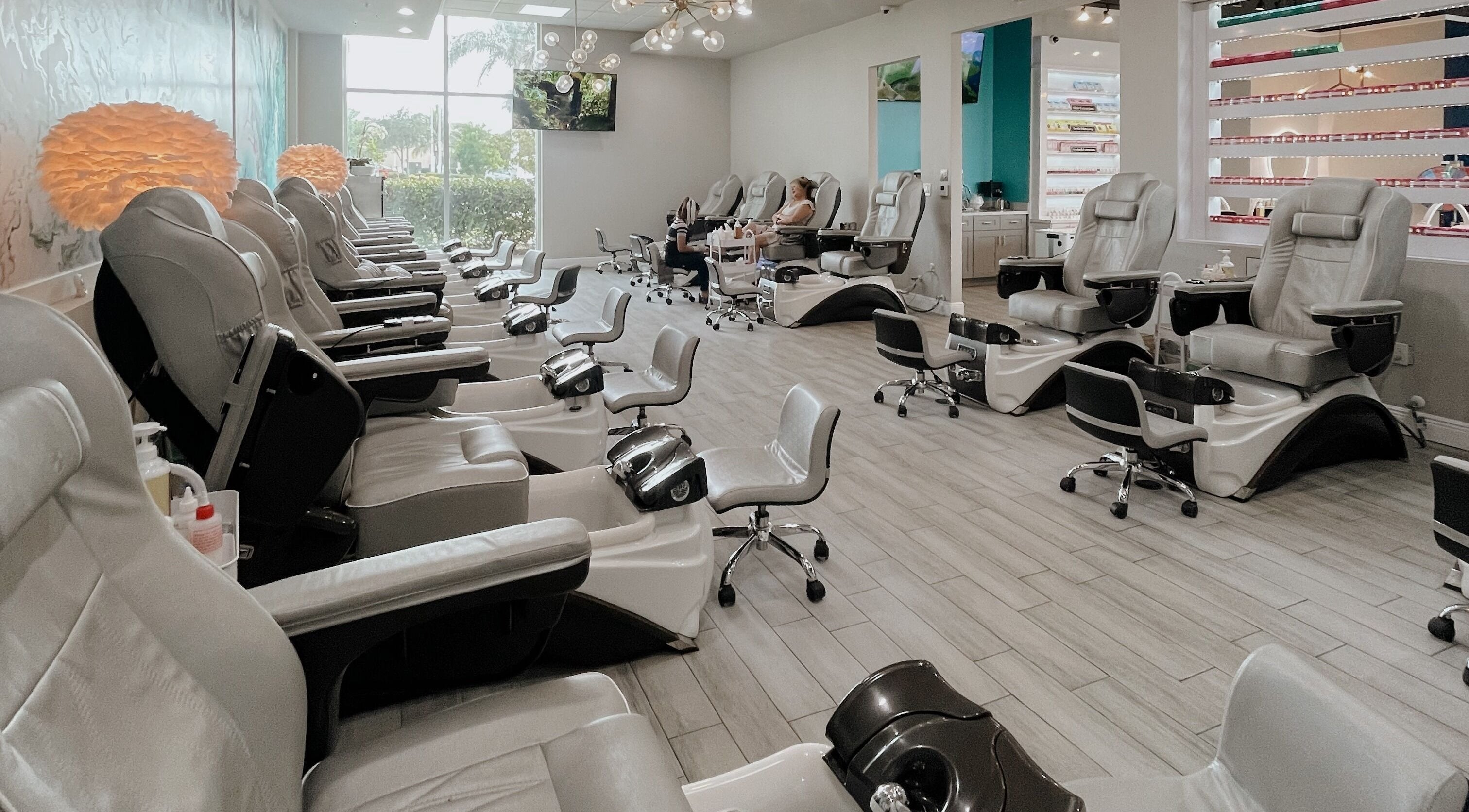 Spacious pedicure area at Tipsy Salonbar Naples, showcasing plush chairs in Naples, Florida, US.