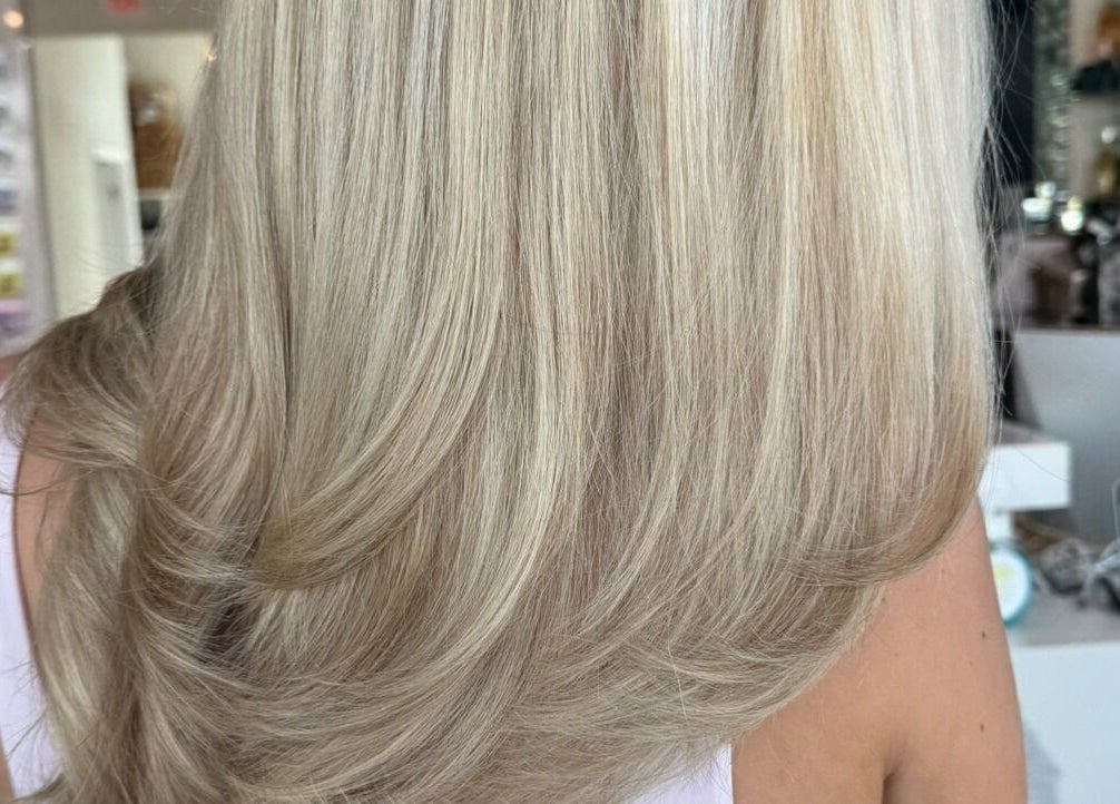 Blonde hair styled perfectly at Tipsy Salonbar Naples in Naples, Florida, US, showcasing elegant salon expertise.