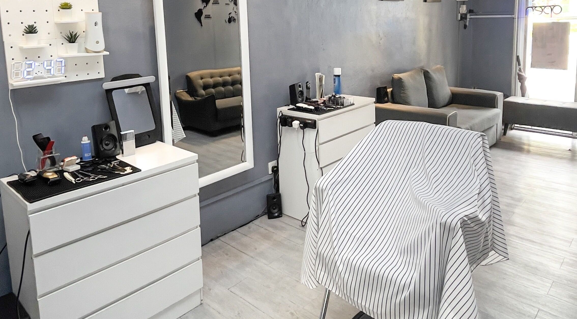 Elegant interior of Unbranded Barbershop in Pasir Gudang, Johor, MY featuring modern decor and styling tools.