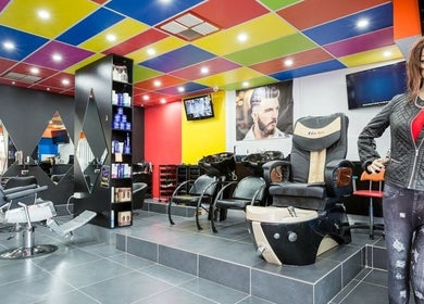 Bright interior of Family Hair & Beauty Salon in Granville, New South Wales, AU with modern chairs and colorful decor.