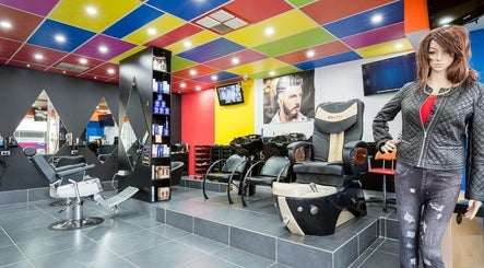 Bright interior of Family Hair & Beauty Salon in Granville, New South Wales, AU with modern chairs and colorful decor.
