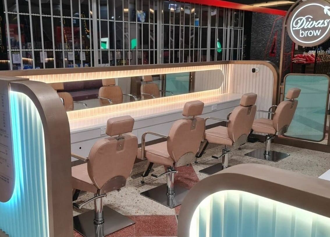Stylish interior of Divas Brow | Erina Fair, Erina, New South Wales, AU showcasing salon chairs and mirrors.