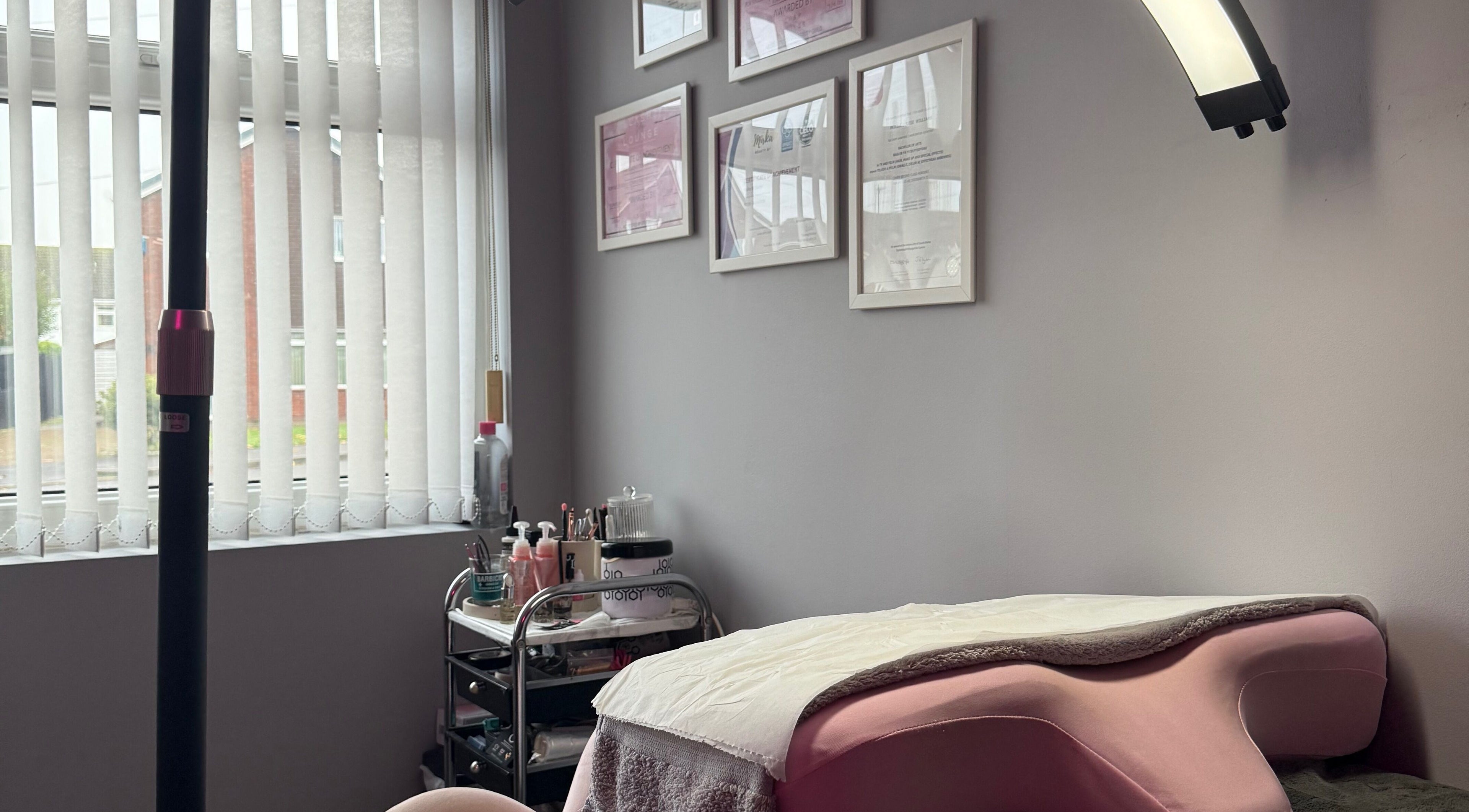 Calm treatment room at Mollie Williams Brows, Barry, Wales, GB, showcasing a cozy aesthetic with decor.