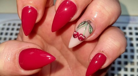 Stylish cherry nail art in bright red at Beautello, Polokwane, Limpopo, ZA.