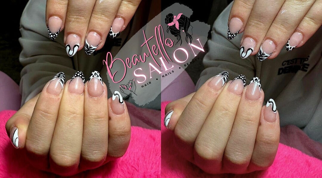 Stylish black and white nail art at Beautello, Polokwane, Limpopo, ZA. Perfect for a trendy look.