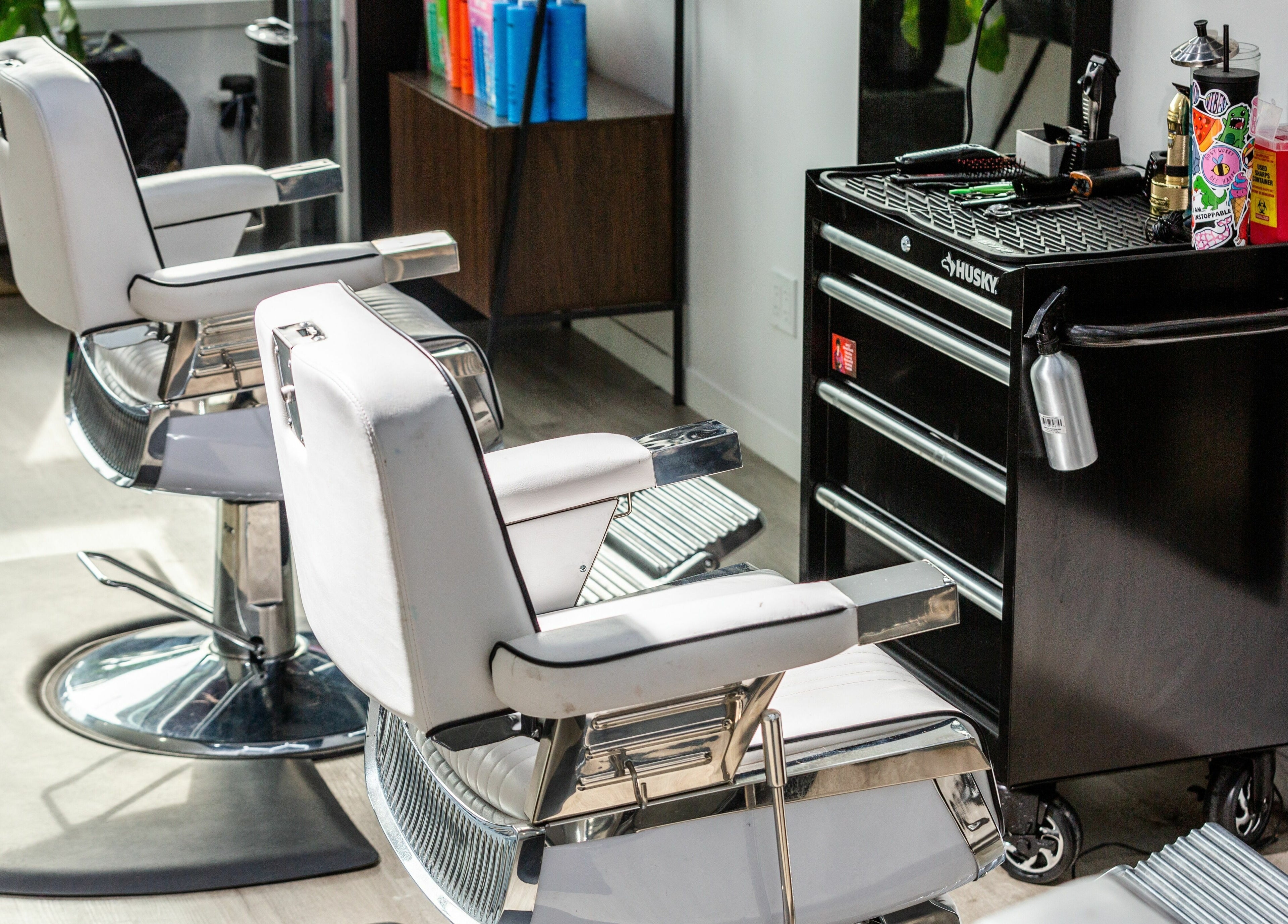 Modern salon chairs and styling station at Rebel X, Calgary, Alberta, CA, showcasing luxury and style.
