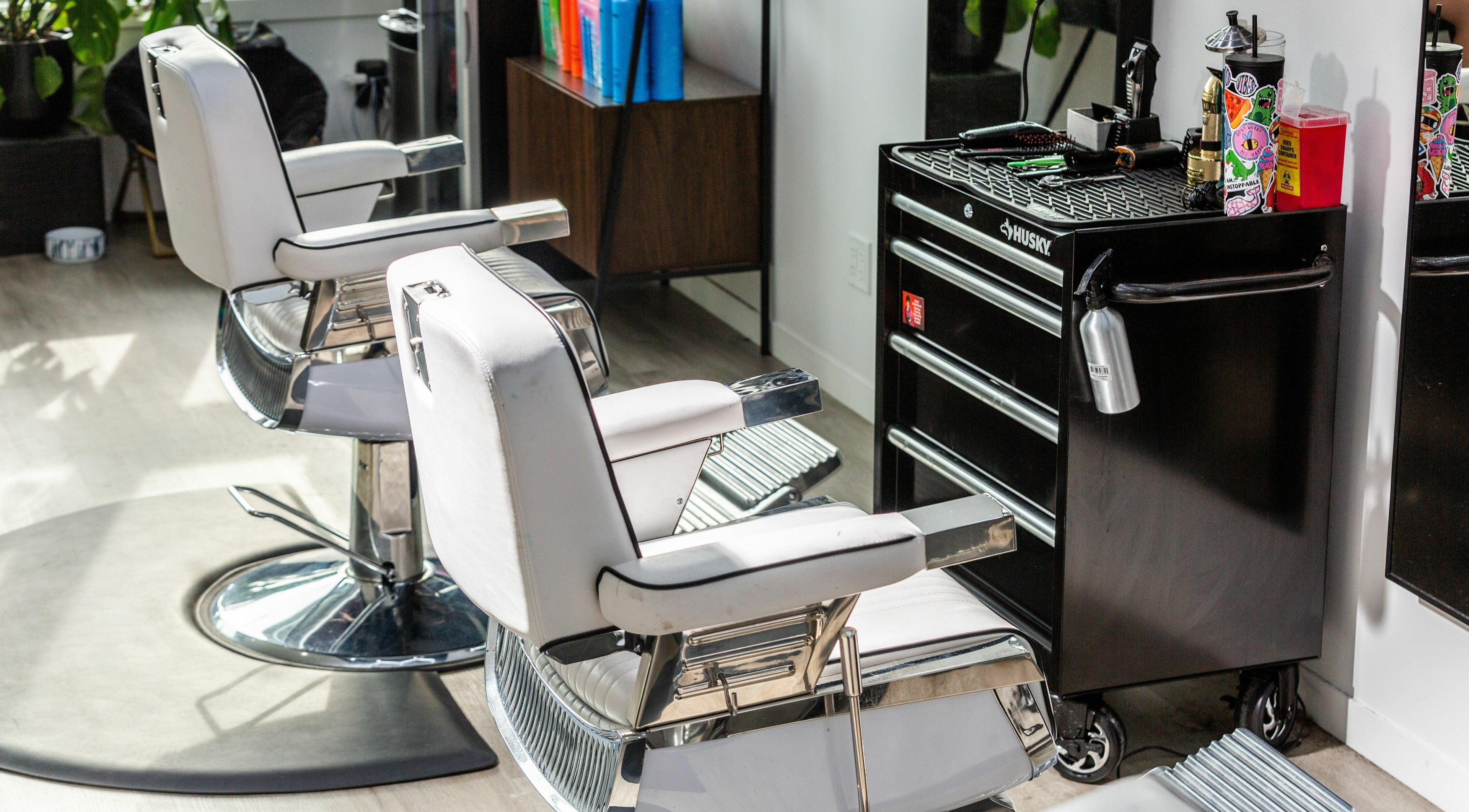 Modern salon chairs and styling station at Rebel X, Calgary, Alberta, CA, showcasing luxury and style.