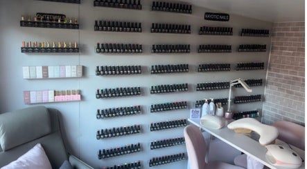 Wall of nail polishes at Kayotic Nails, Andover, England. Bright, organized space for manicures.