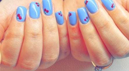 Vibrant blue nails with cherry art from Kayotic Nails, Andover, England, GB.