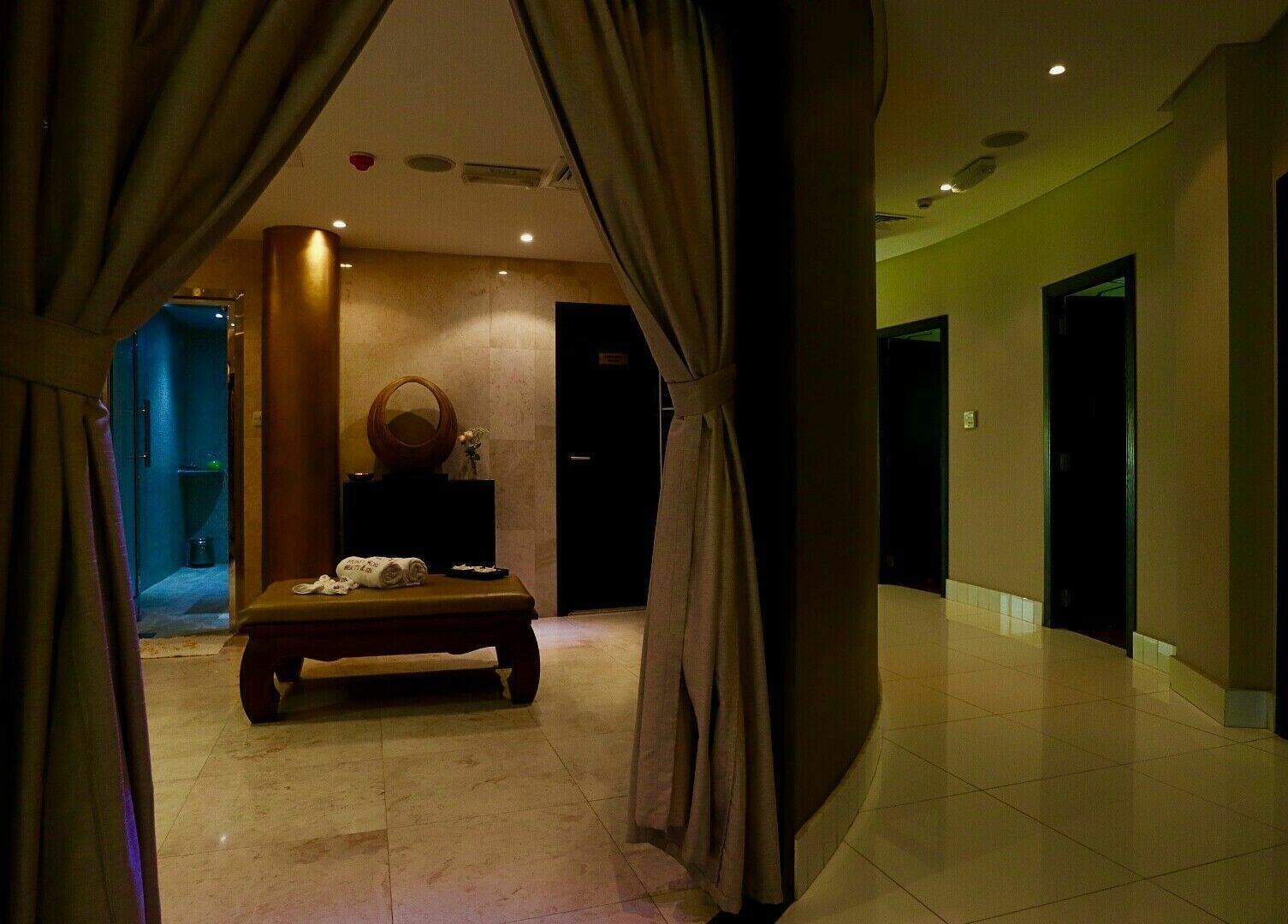 Relaxing spa room at Honeyrose Spa & Salon, Dubai, Dubai, AE with warm lighting and elegant decor.