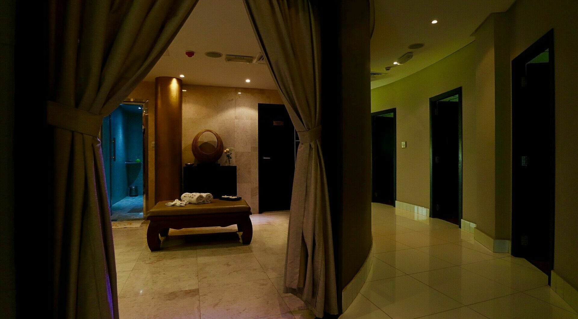 Relaxing spa room at Honeyrose Spa & Salon, Dubai, Dubai, AE with warm lighting and elegant decor.